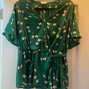 Green floral across tie peplum style blouse